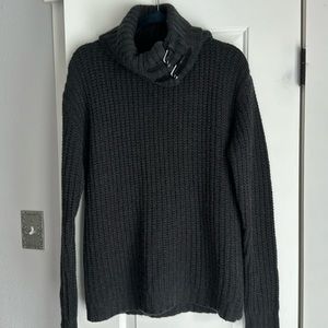 Cashmere and leather buckle sweater.